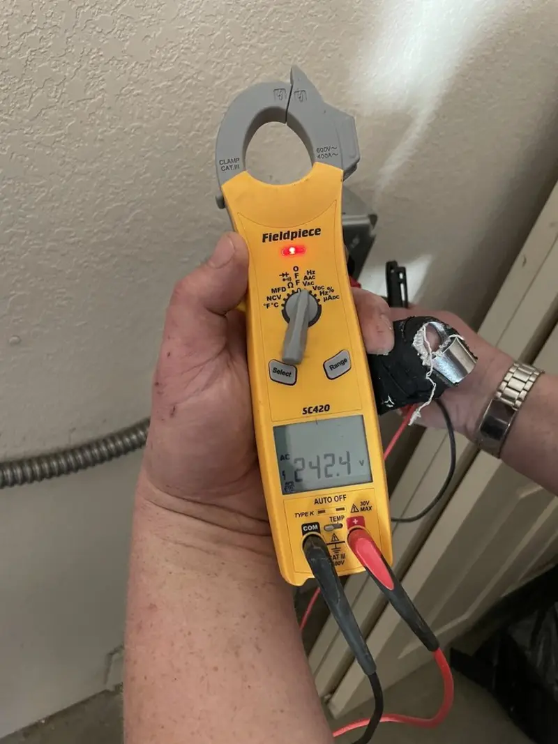 Voltage testing with clamp meter during Recessed Lighting Installation in Sun Lakes